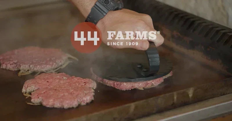 Carbon Steel Smash Burger Press on the griddle