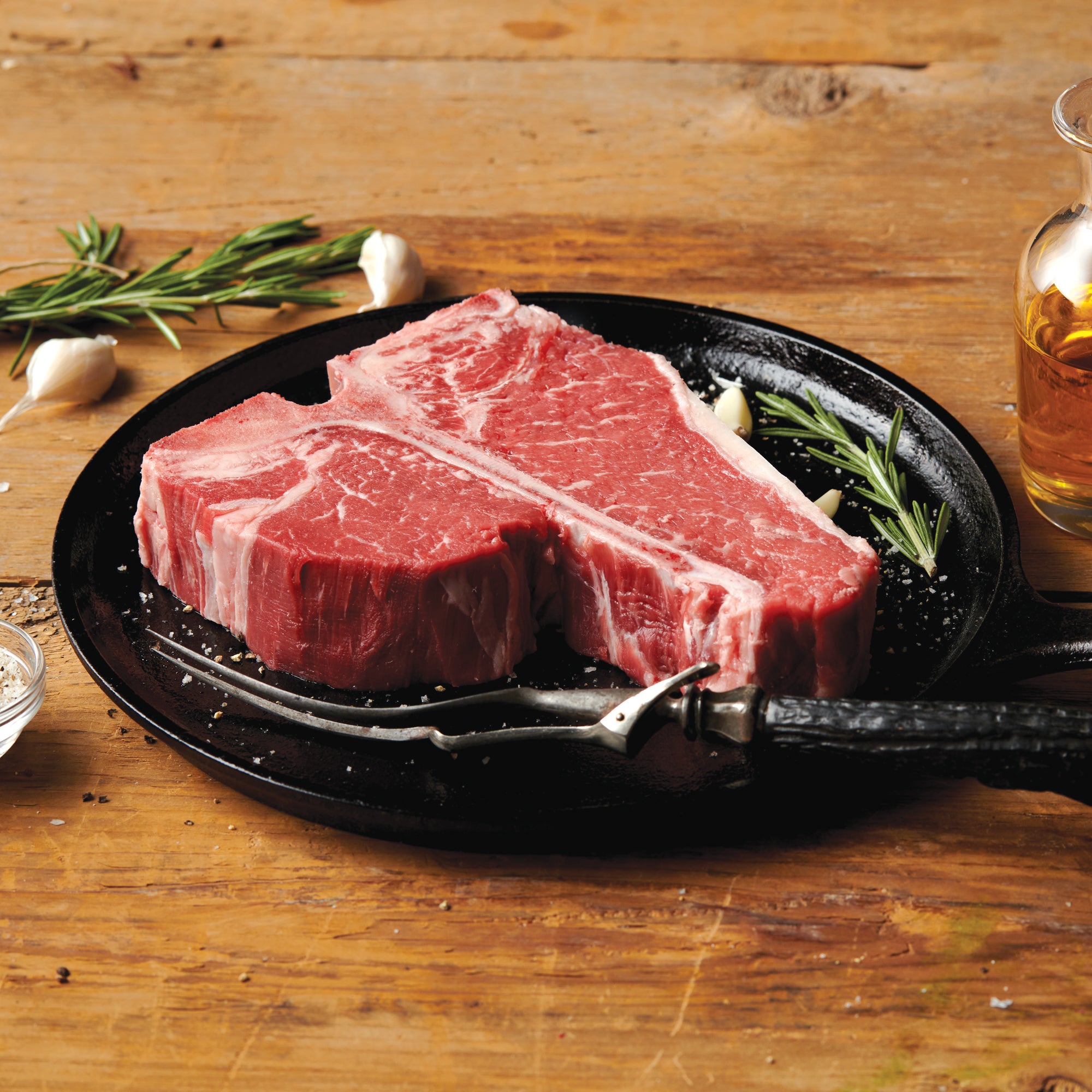 30 oz USDA Choice Porterhouse Steak on a skillet