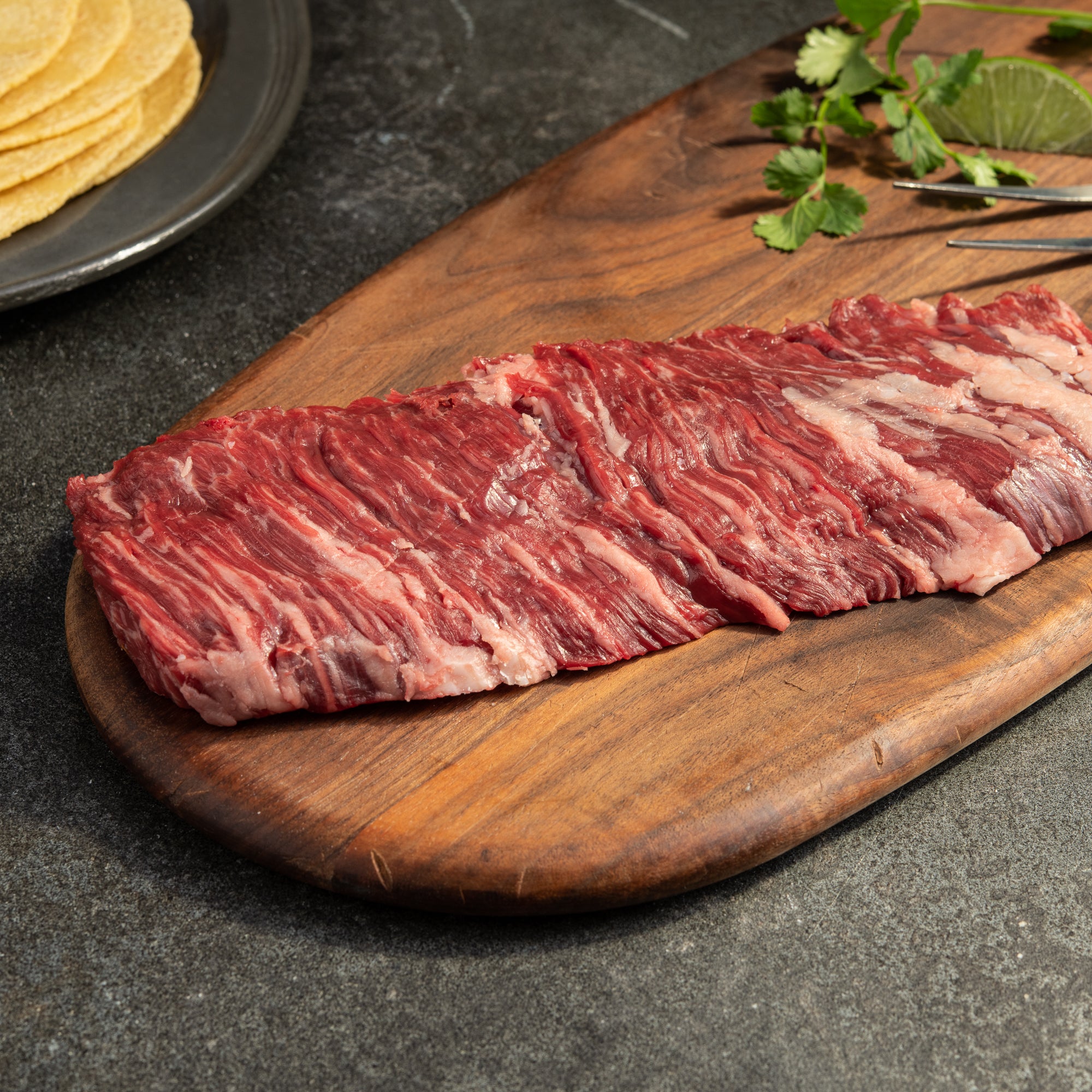 44 Farms usda choice outside skirt steak on wooden cutting board